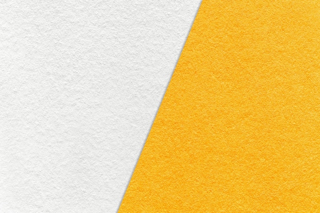 Texture of craft white and yellow paper background half two colors macro Vintage dense kraft orange cardboard