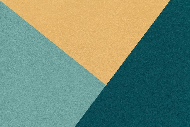 Texture of craft yellow cyan and emerald shade color paper background macro Vintage abstract teal cardboard