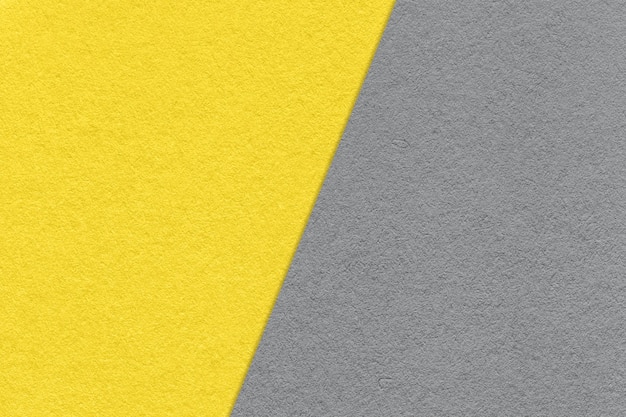 Texture of craft yellow and gray paper background half two colors macro Structure of vintage dense kraft grey cardboard