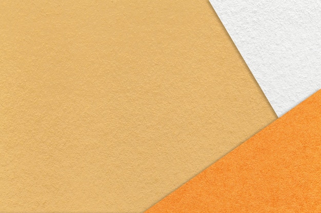 Texture of craft yellow paper background with white and orange border Vintage ocher cardboard