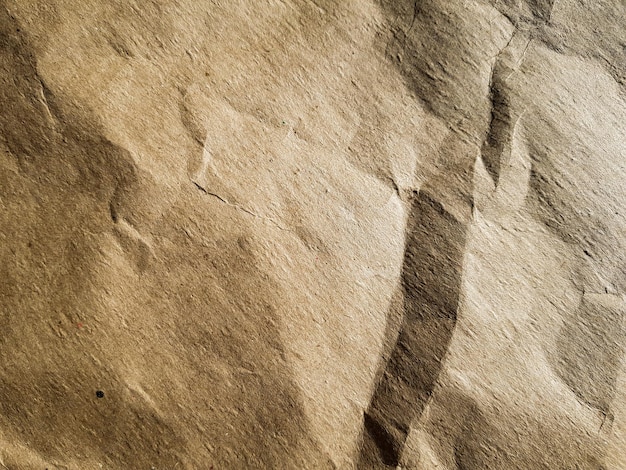 Texture of crumpled brown craft paper background