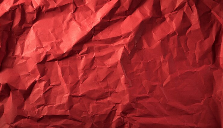 Texture of crumpled red paper