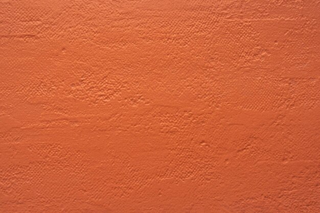 Texture of dark orange decorative plaster or concrete abstract background for design