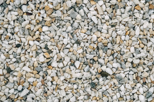 Texture of decorative stones or gravel as a background image. Top view. Copy, empty space for text.