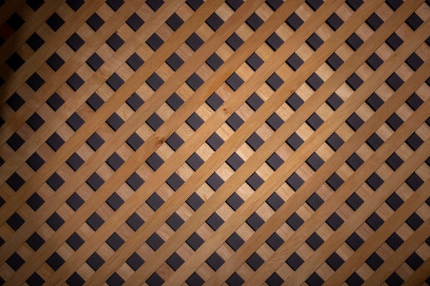 Photo texture of decorative wooden lattice with colored background