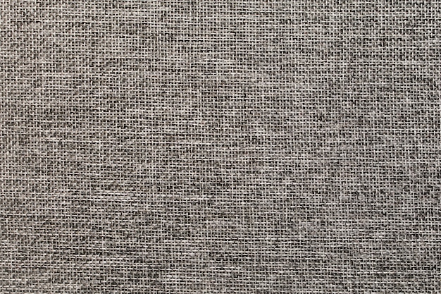 texture of dense beige fabric as a natural background