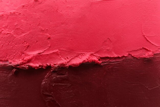 Texture of different lipsticks as background closeup