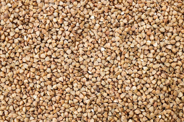 The texture of dry buckwheat Background image of buckwheat porridge