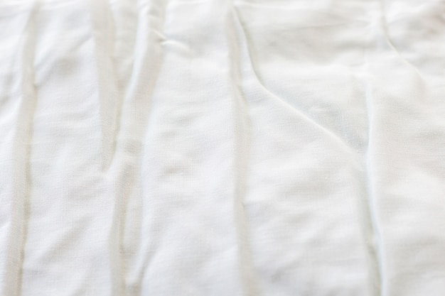 Texture of fabric is white color background,Wavy folds of cloth