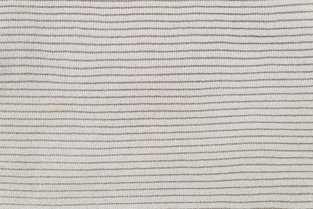 Texture of the fabric of a warm white sweater