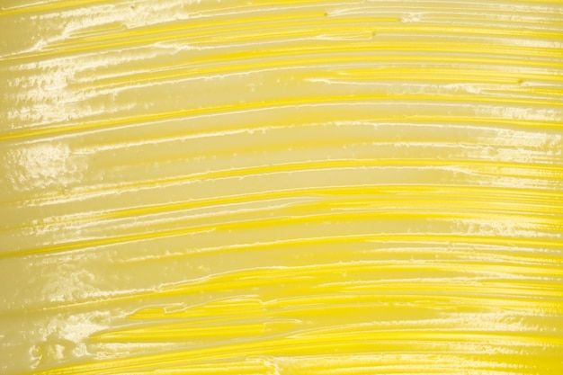 Texture of face scrub on yellow background