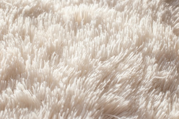 Texture of fluffy white artificial plaid close up