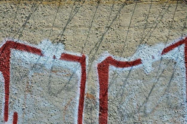 Texture of a fragment of the wall with graffiti painting which is depicted on it An image of a piece of graffiti drawing as a photo on street art and graffiti culture topics