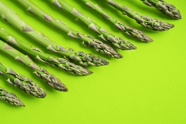 Photo texture of fresh green asparagus, top view.