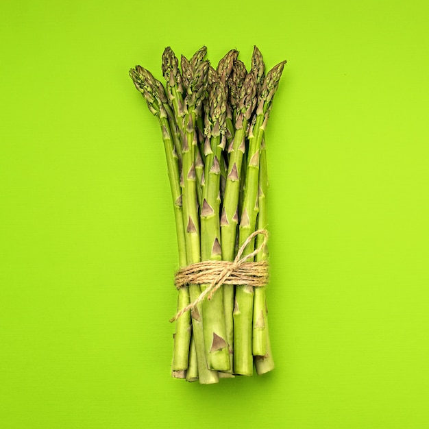 Texture of fresh green asparagus, top view.