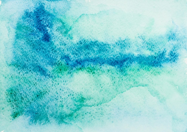 Текстура от синих и зеленых акварельных пятен на белой бумаге