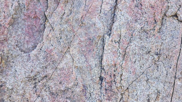 Texture of granite Granite rock with reddish color Background from solid stone