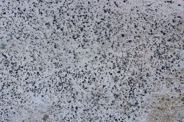 Texture of gray concrete with small stones Background image of old cement