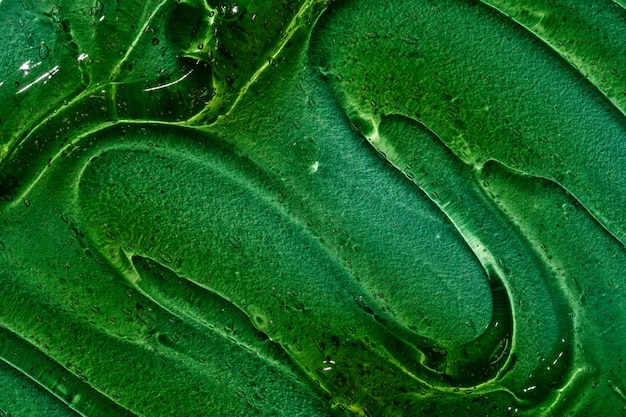 Photo texture of green aloe vera gel top view