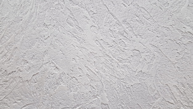 灰色の装飾的な石膏またはコンクリートの質感。あなたのデザインの抽象的な背景。