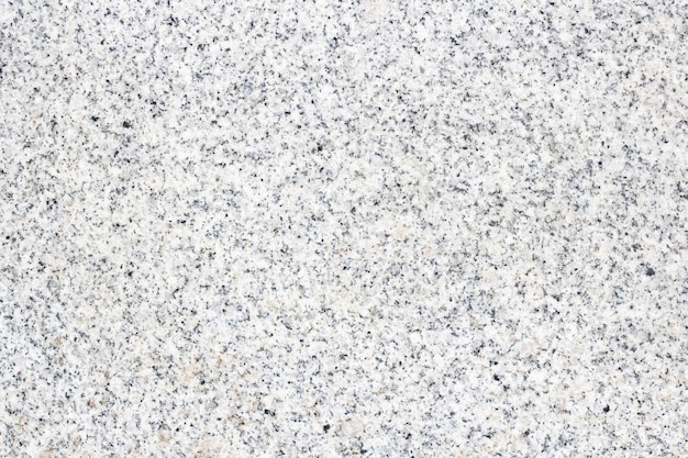 Texture of grey granite stone close up