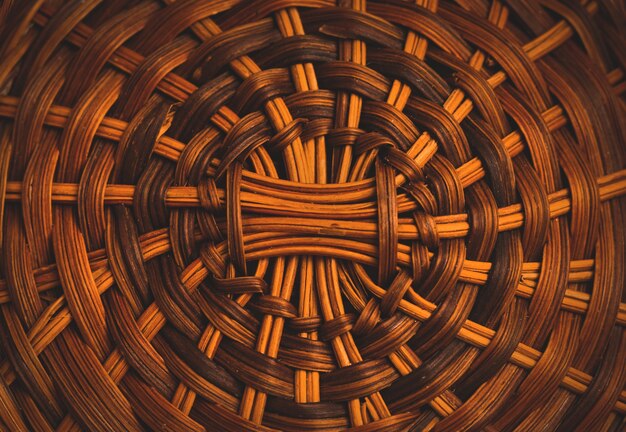 Texture of handmade wicker basket from below, home style furniture, macro background photo