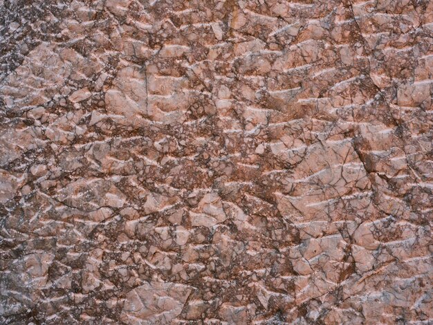 Texture of a hard and weathered granite stone