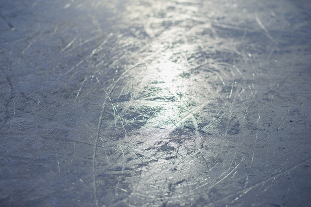 The texture of the ice skating rink, skated, closeup. open ice
rink winter background