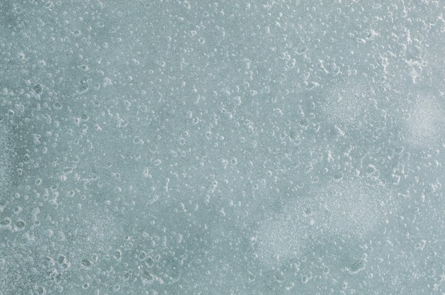 Photo texture of ice with air bubbles, background.