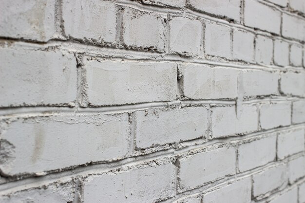 The texture is a white brick wall at an angle