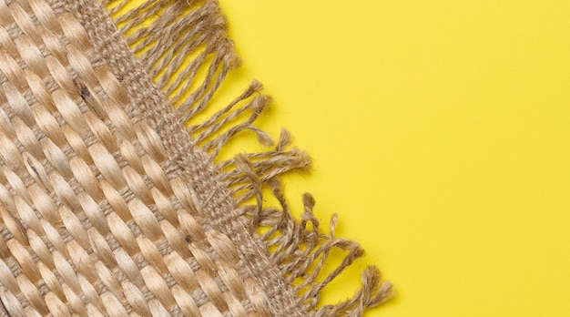 The texture of a jute brown fabric with a large interlacing of fibers