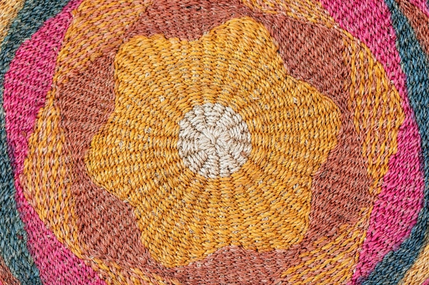 Texture of jute knitted rug carpet with characteristic\
traditional saturated colors