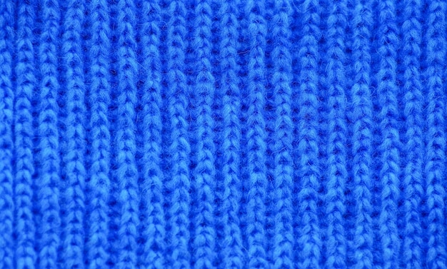 The texture of a knitted woolen fabric blue