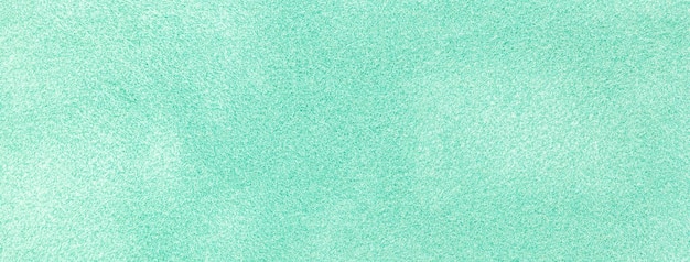 Texture of light cyan velvet matte background macro Suede mint fabric with pattern Green textile leather backdrop