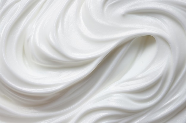 柔らかい線の上面図を持つ液体の白いクリームの質感