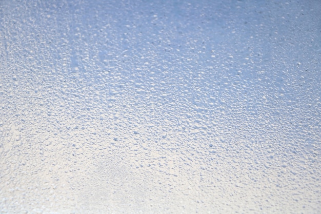 texture of many droplets on mirror blue and white tone color for background