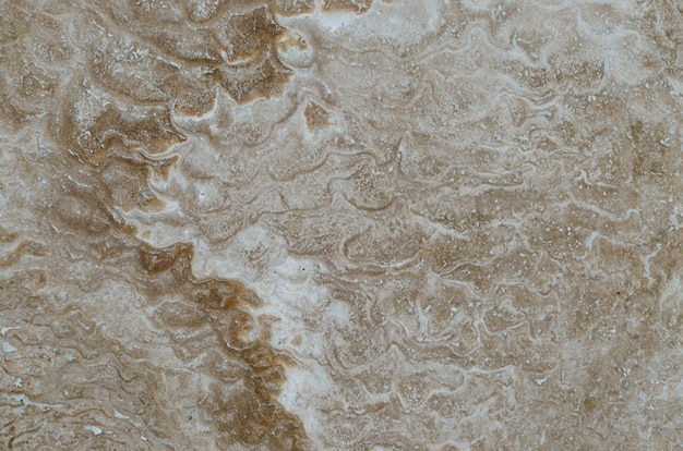 Texture marble stone brown beige closeup. Background of the marble