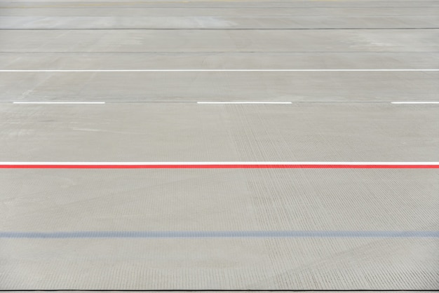 Photo texture of modern airport runway with stripes.