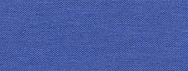 Texture of navy blue color background from textile material with wicker pattern macro Structure of vintage denim fabric cloth narrow backdrop