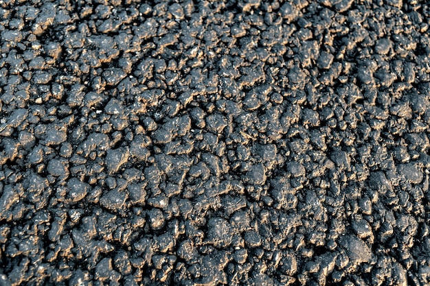 Texture of new asphalt road close up