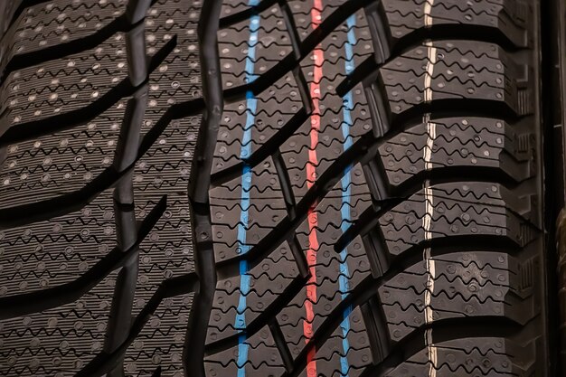 Texture of a new winter tires for car closeup.