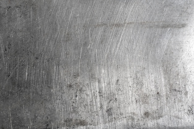 Фото Текстура старой грязной бетонной стены как фон. красная стрелка в центре доски для дартса крупным планом показывает концепцию постановки бизнес-целей