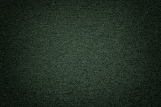 Текстура старой темной предпосылки зеленой бумаги, крупного плана. структура плотного глубокого голубоватого картона.