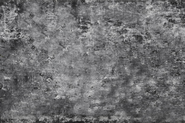 The texture of the old black chalk board with white chalk stains