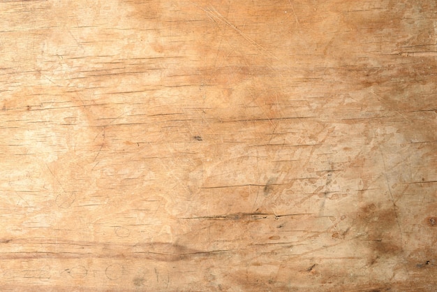 Texture of a old brown wooden cutting board, full frame, backdrop for the designer, close up