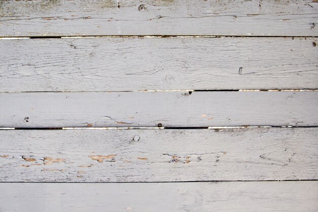 Texture of old cracked paint on wooden boards.