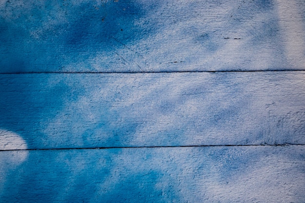 Texture of old cracked paint on wooden boards.