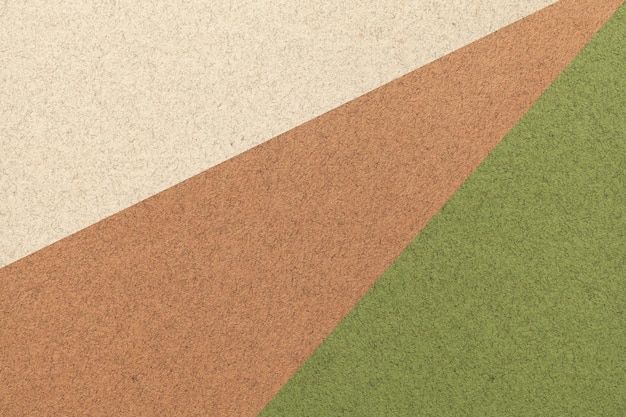 texture of old craft beige brown and green color paper background macro vintage abstract olive cardboard