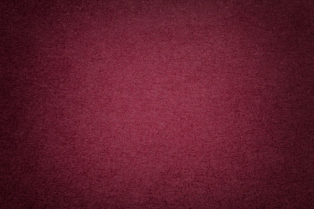 Photo texture of old dark red paper background