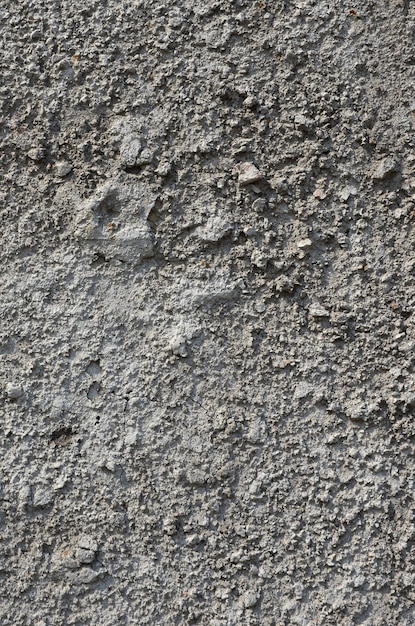 Texture of the old embossed concrete wall in gray color. 